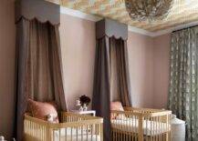 Nursery features dual gold oak cribs with orange and taupe scalloped valance and curtains, green animal print curtains and orange ceilng wallpaper.