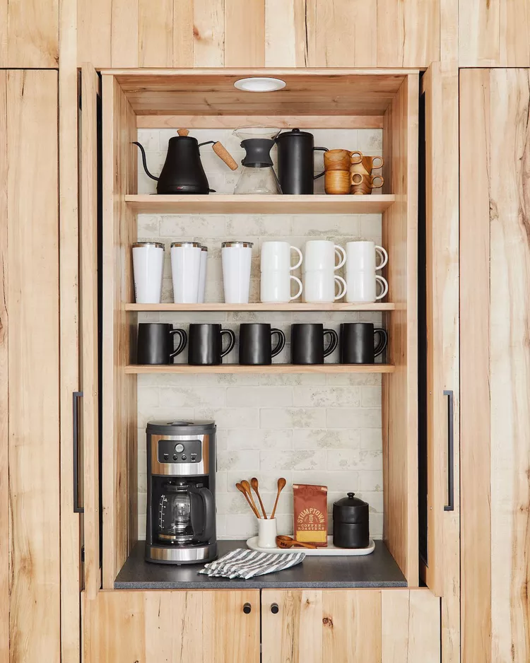 Coffee bar in a natural bamboo wood cabinet.