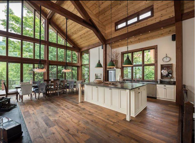 Beautiful wood detailing on this cottage floor-to-ceiling window.