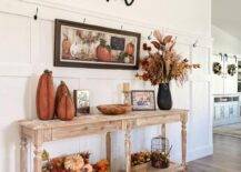 Fall entry wall with console table and welcome sign.