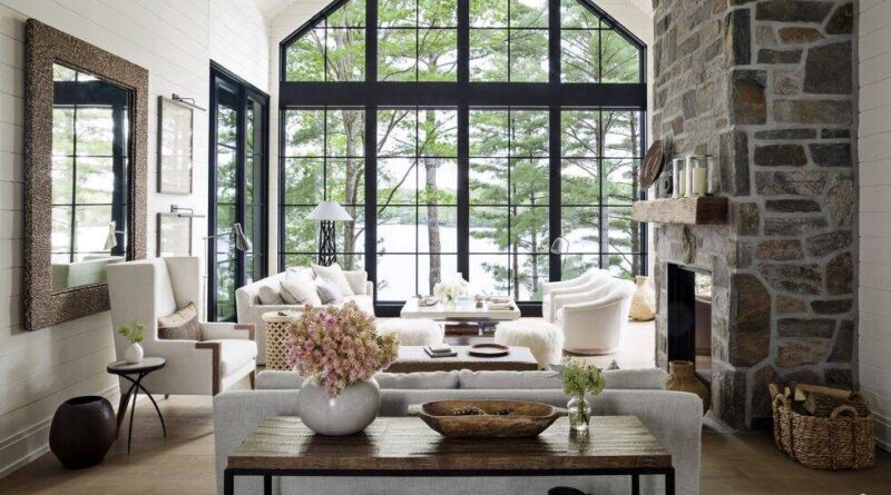 Modern living room flanked by grid-like floor-to-ceiling windows.