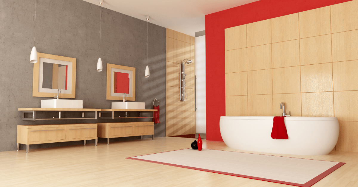 Banheiro moderno com cores claras que contrastam bem com os fortes detalhes em vermelho.