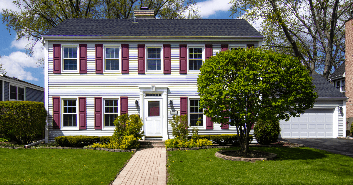The exterior of a colonial style house.