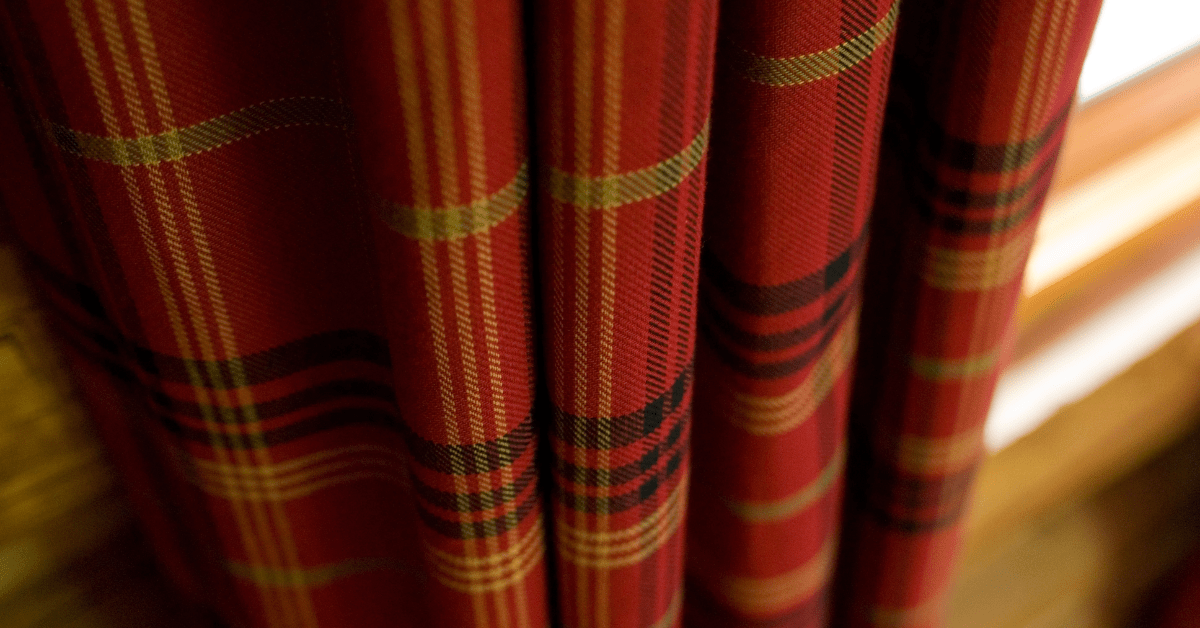 Living room curtains with plaid pattern.