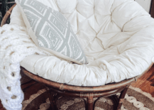 white papasan chair with large cushion and brown wood base