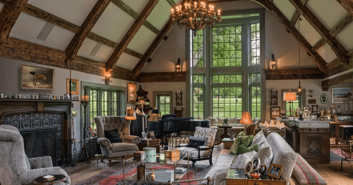 Living room of a Tudor style house with matching styled pieces of furniture and decor.