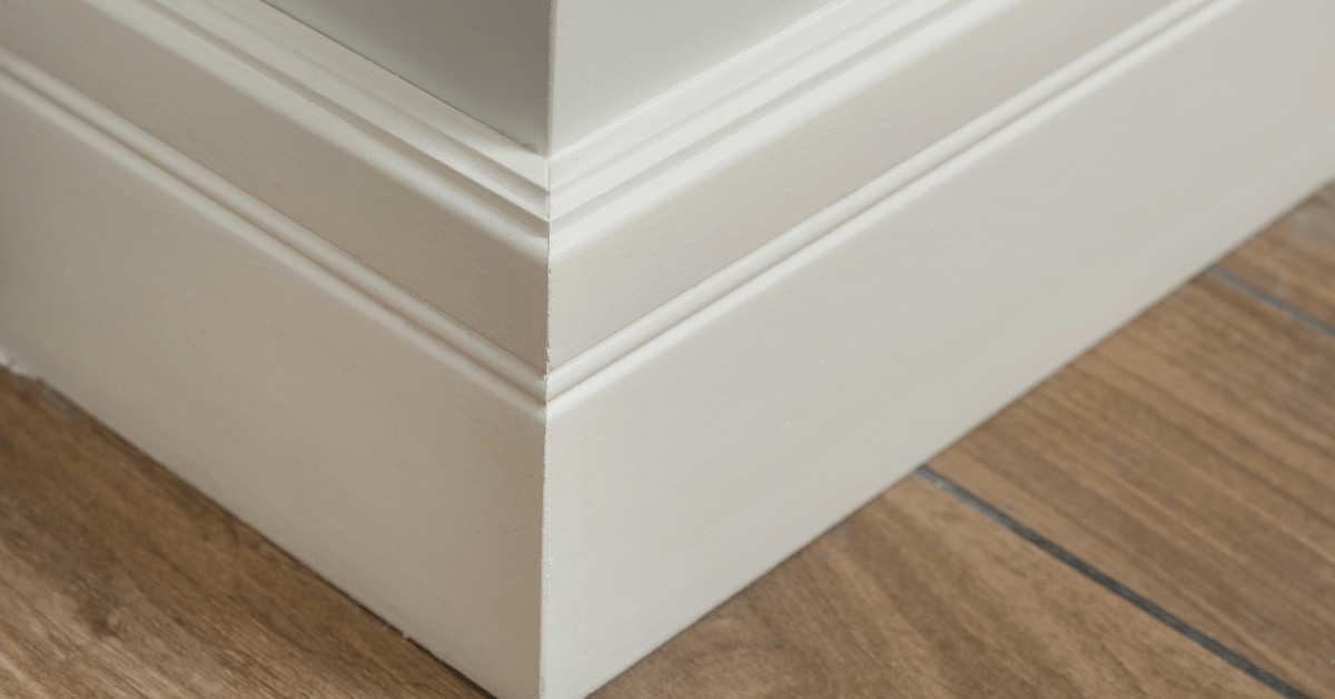 A corner of white baseboards.