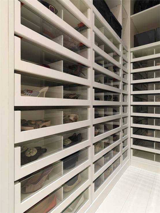 Fabulous closet with acrylic front pull-out shoe cabinets.