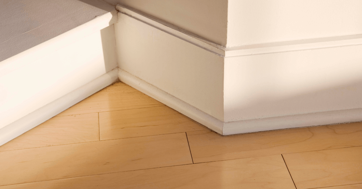 A closeup of white baseboards.