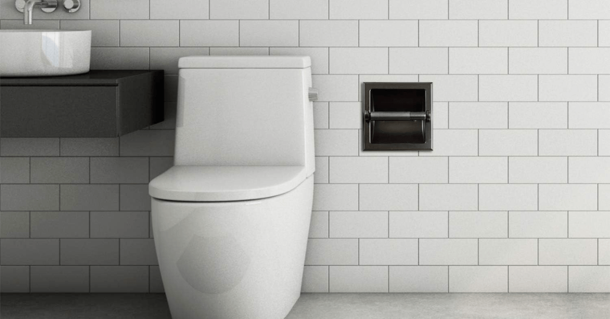 Porta-papel higiênico embutido em preto em um banheiro com tema branco.
