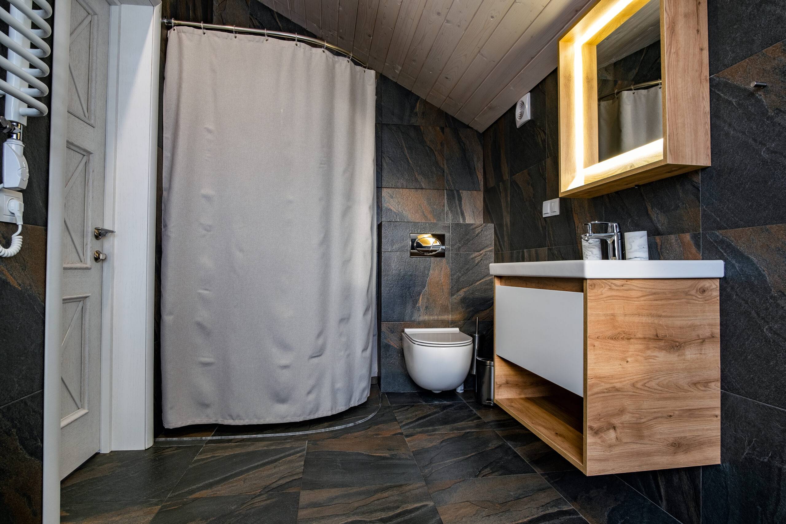 interior-of-modern-stylish-bathroom-with-black-til-2023-11-27-05-10-00-utc-35952-scaled