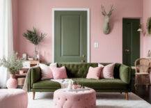 Living room with pink walls and olive green couch.