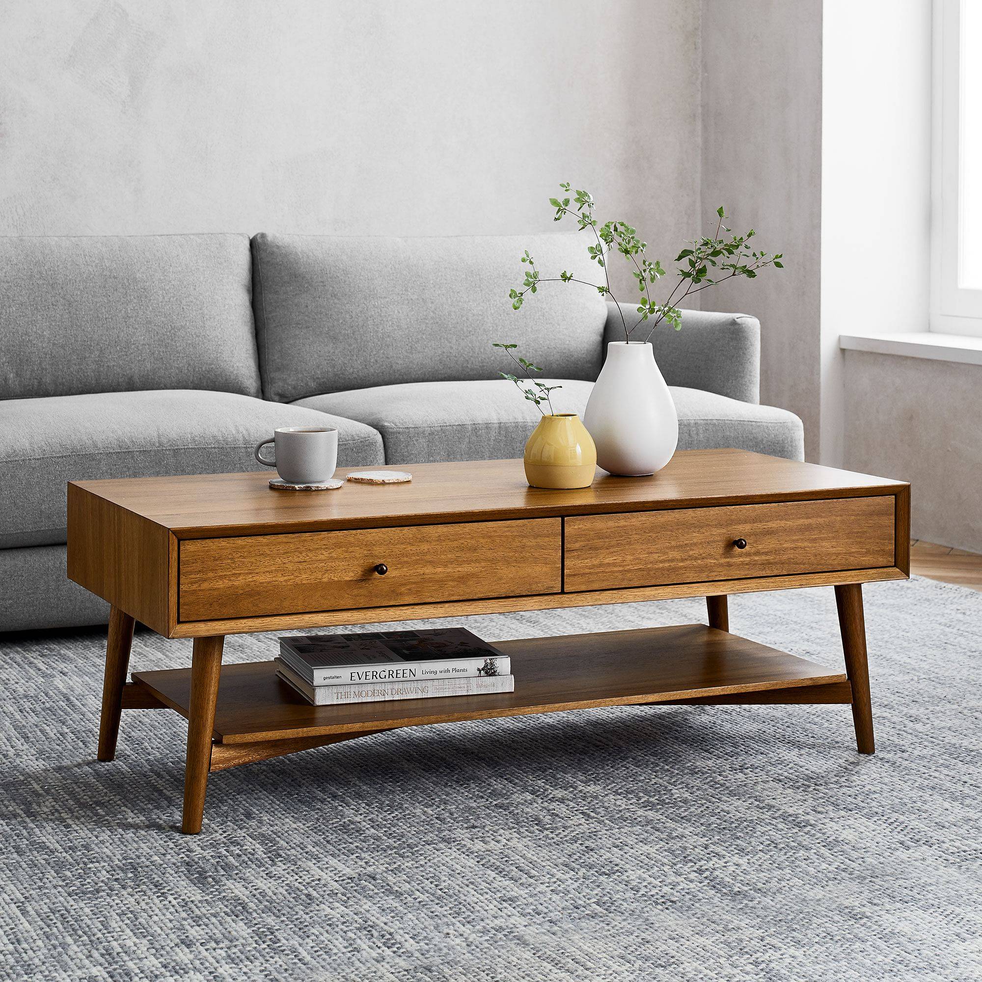 Long wooden coffee table in a boho style living room.