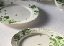 white dinner plates with green leaf design