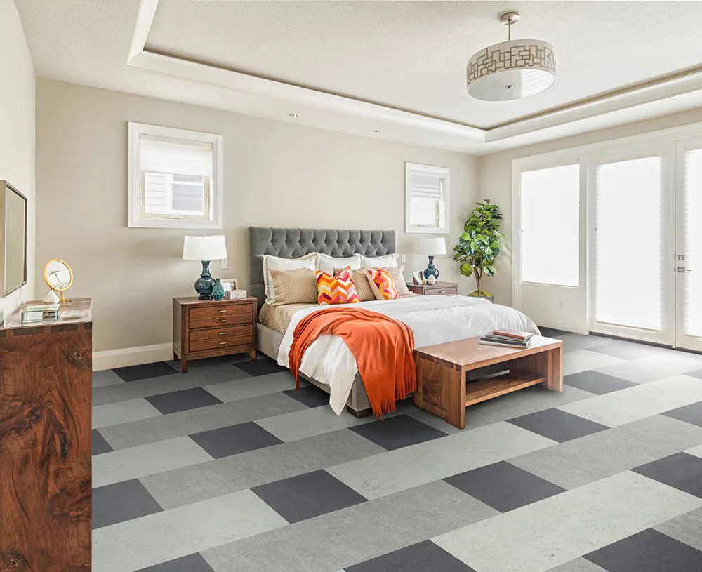 Bedroom with linoleum flooring.