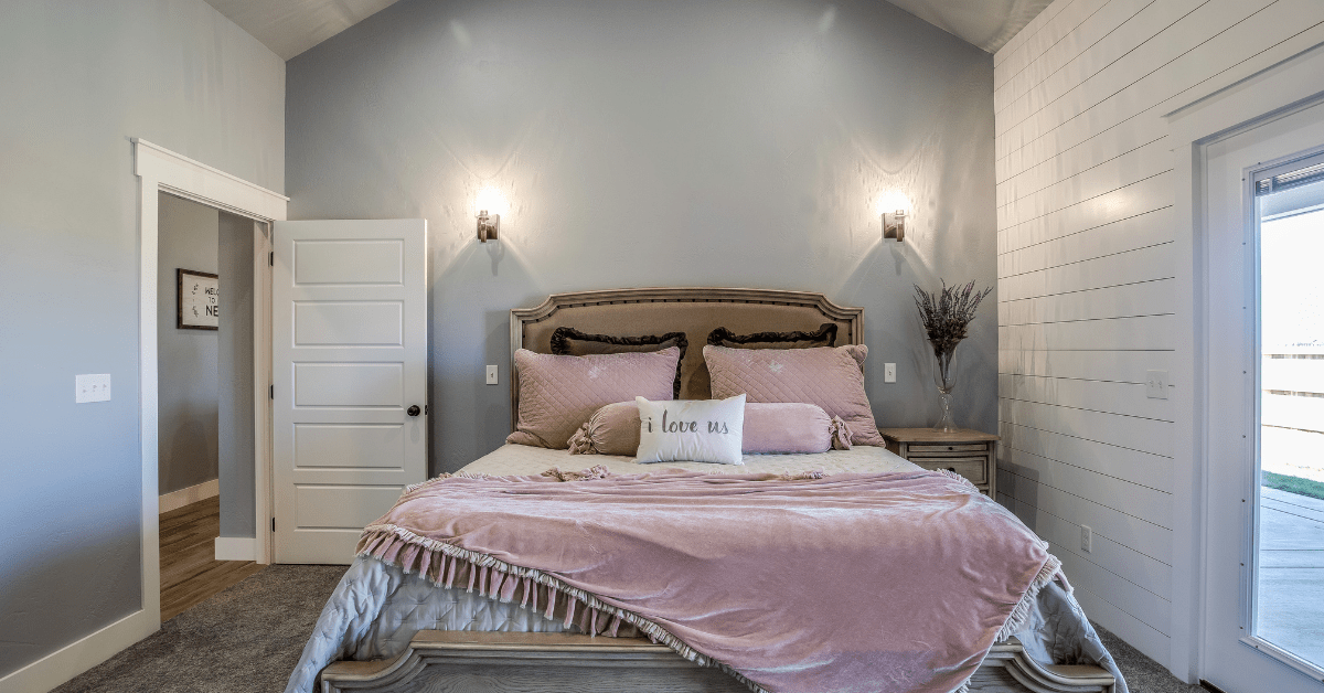 Chic bedroom with a shiplap focal wall.