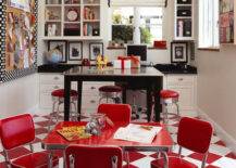 Fun craft room with white & red checkered floors, red retro mini table with red vinyl retro mini chairs, pub table, retro red bar stools, built-in cabinets & cubbies with black granite countertops and white roman shade with black ribbon trim.