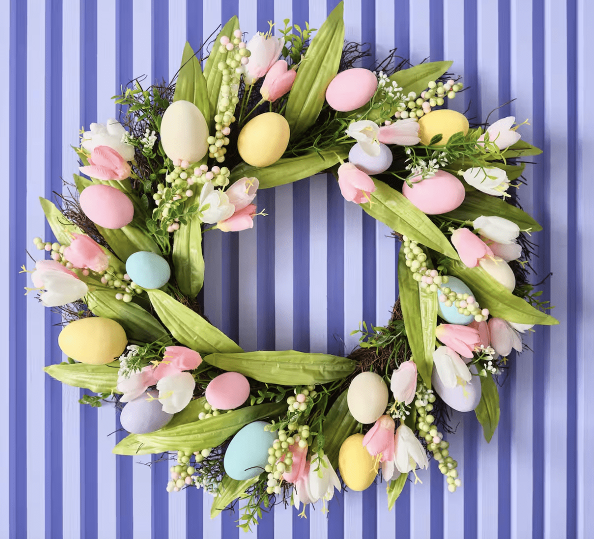 egg and tulip wreath for easter on a blue stripped background
