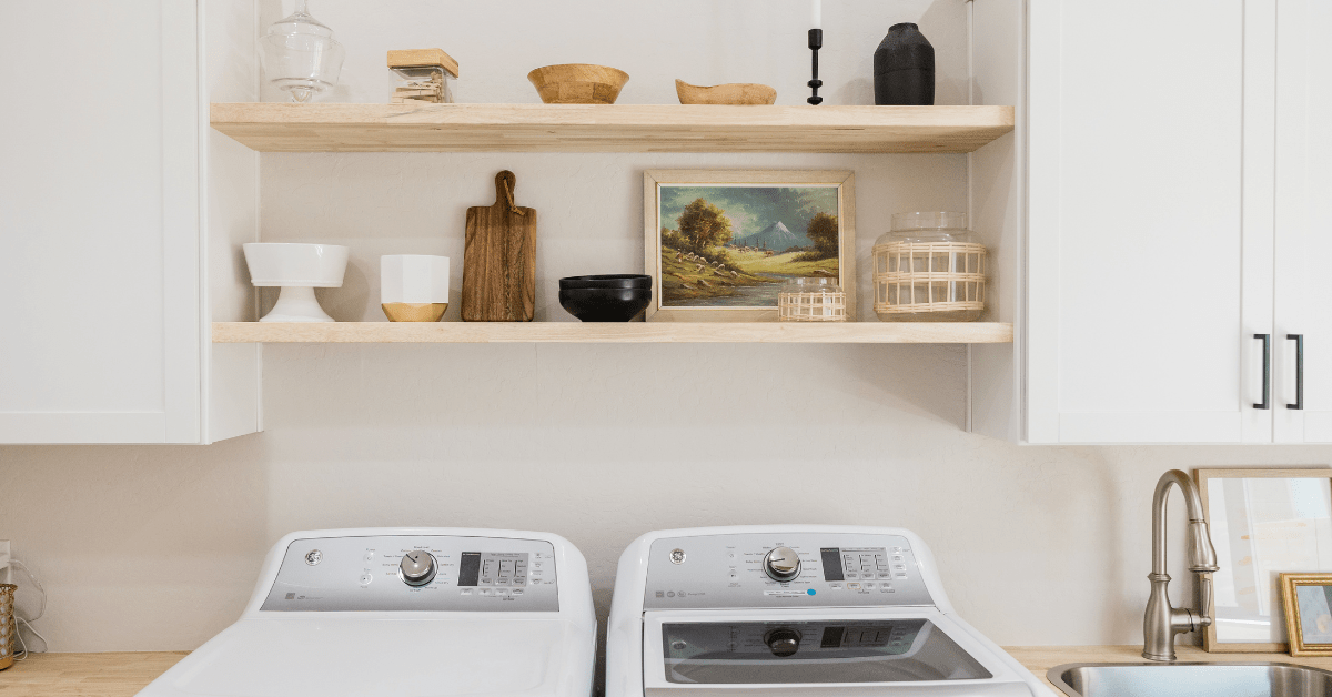 Floating shelves in an organized laundry room.