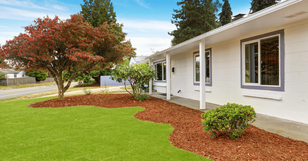 A home with mulch front yard landscaping.