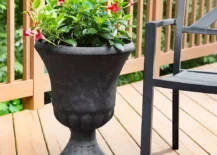 black patio urn on wood porch