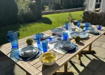 outdoor table set with blue dishes