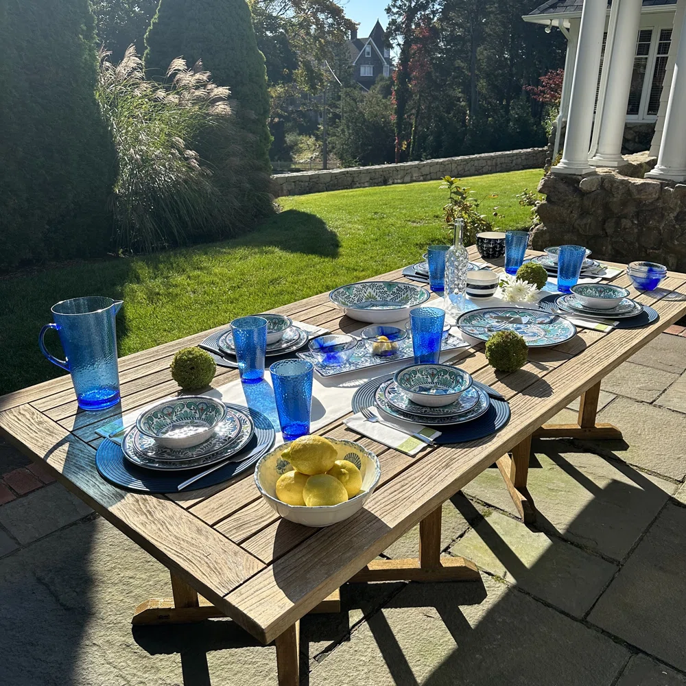 outdoor table set with blue dishes