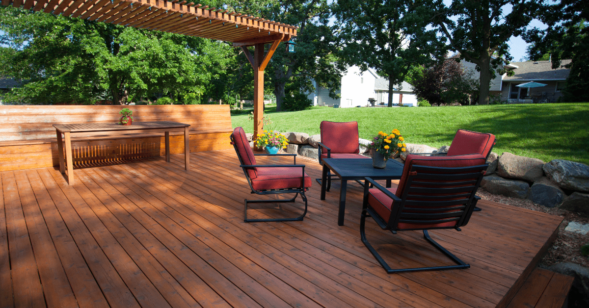 A wooden deck with seating.