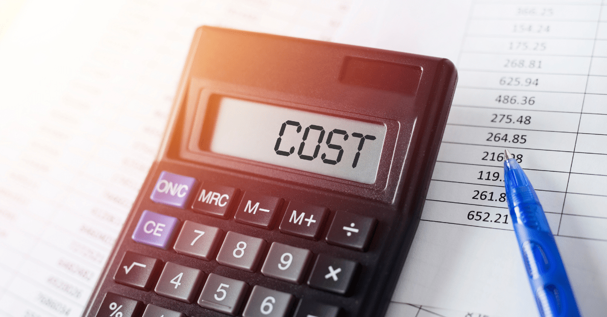 A calculator that reads "COST"