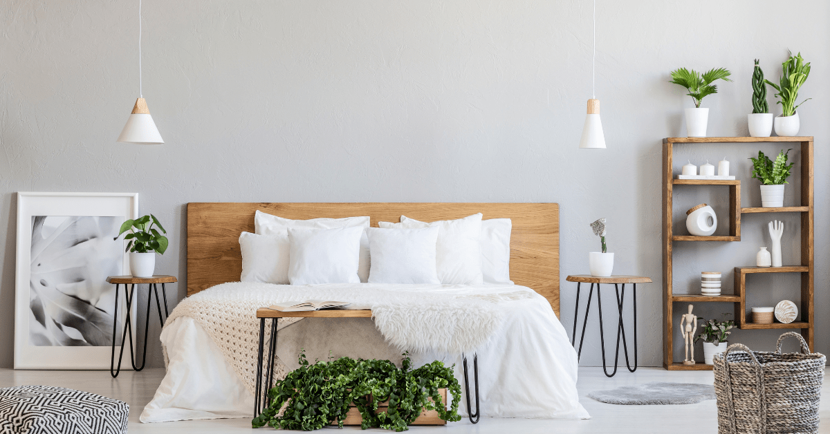 A white bedroom with wooden accents.
