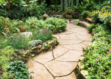 A bright stepping stone walkway with cover plans on the edges.