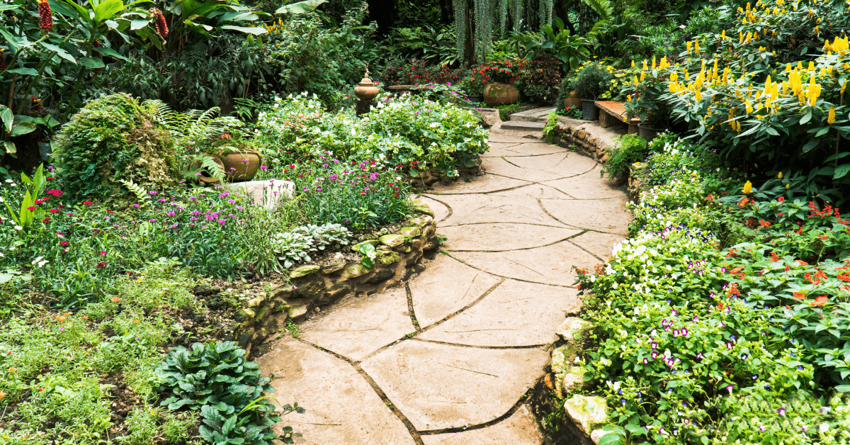 A bright stepping stone walkway with cover plans on the edges.
