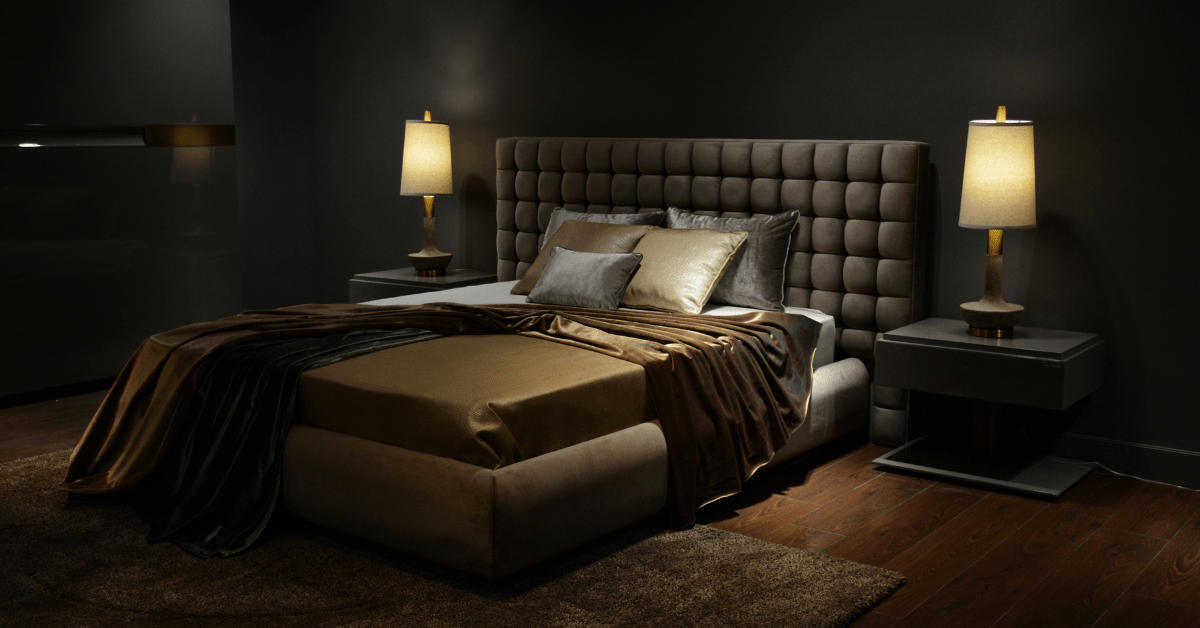A bedroom with neutral yet dark color.