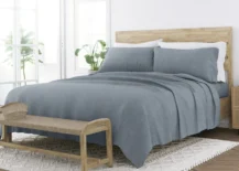 grey bamboo linen sheet set on queen wood bed in white bedroom