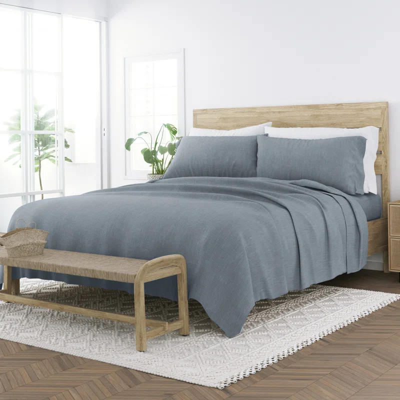 grey bamboo linen sheet set on queen wood bed in white bedroom