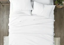 white microfiber bedsheets on bed top view photo
