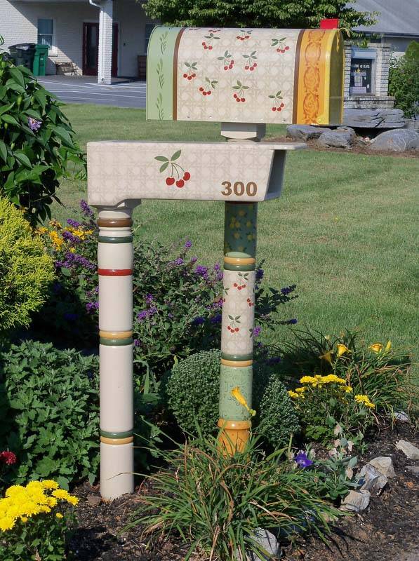 matching mailboxes with cherries on them