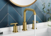 gold faucet in powder room