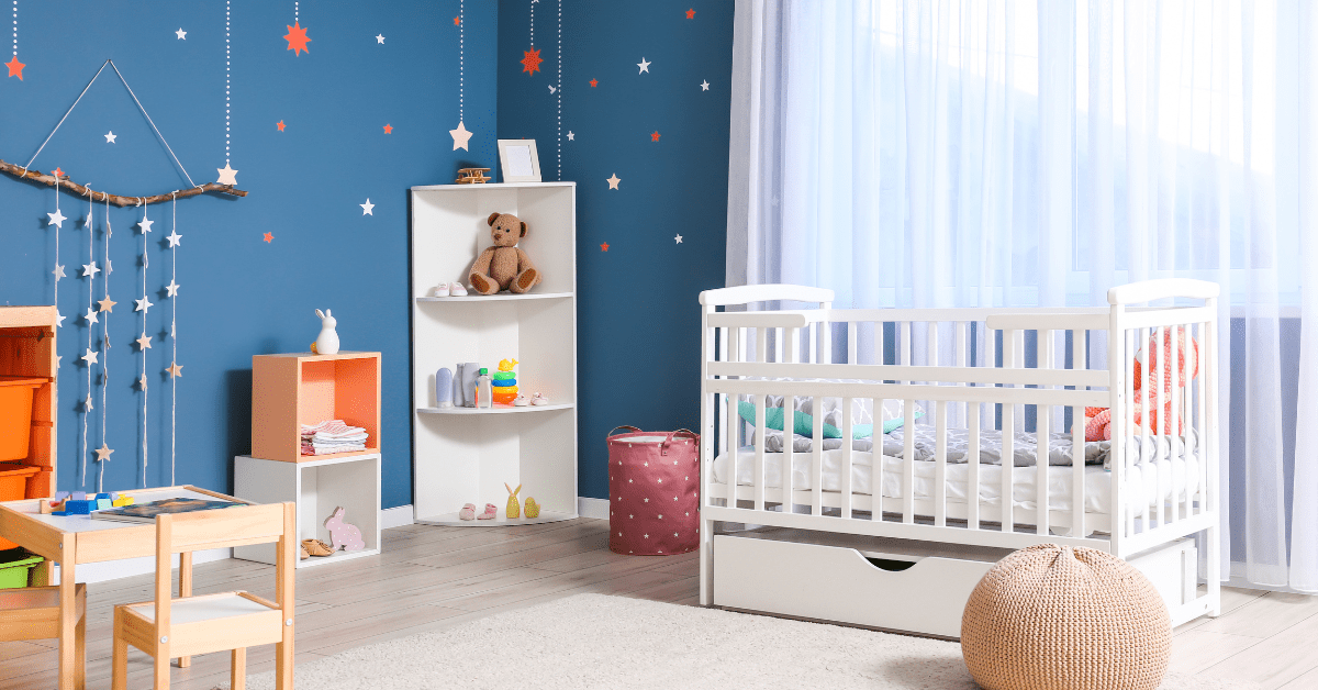 A colorful nursery room that is small.