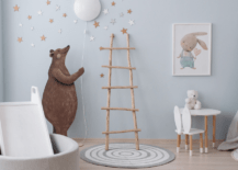 A blue small nursery with bear