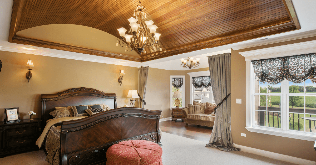A bedroom with curved wood ceiling.