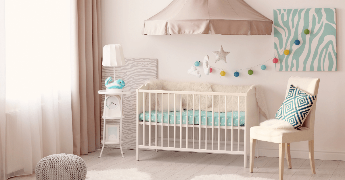 Pink small nursery with cute decor.