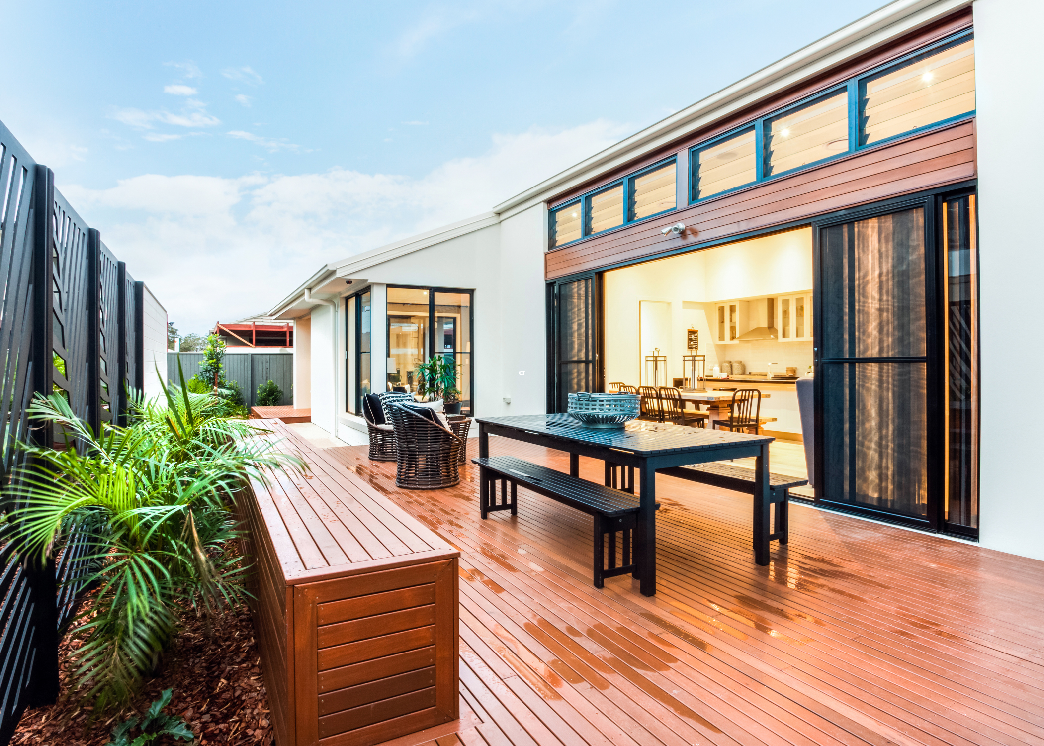 large modern deck with table and benches