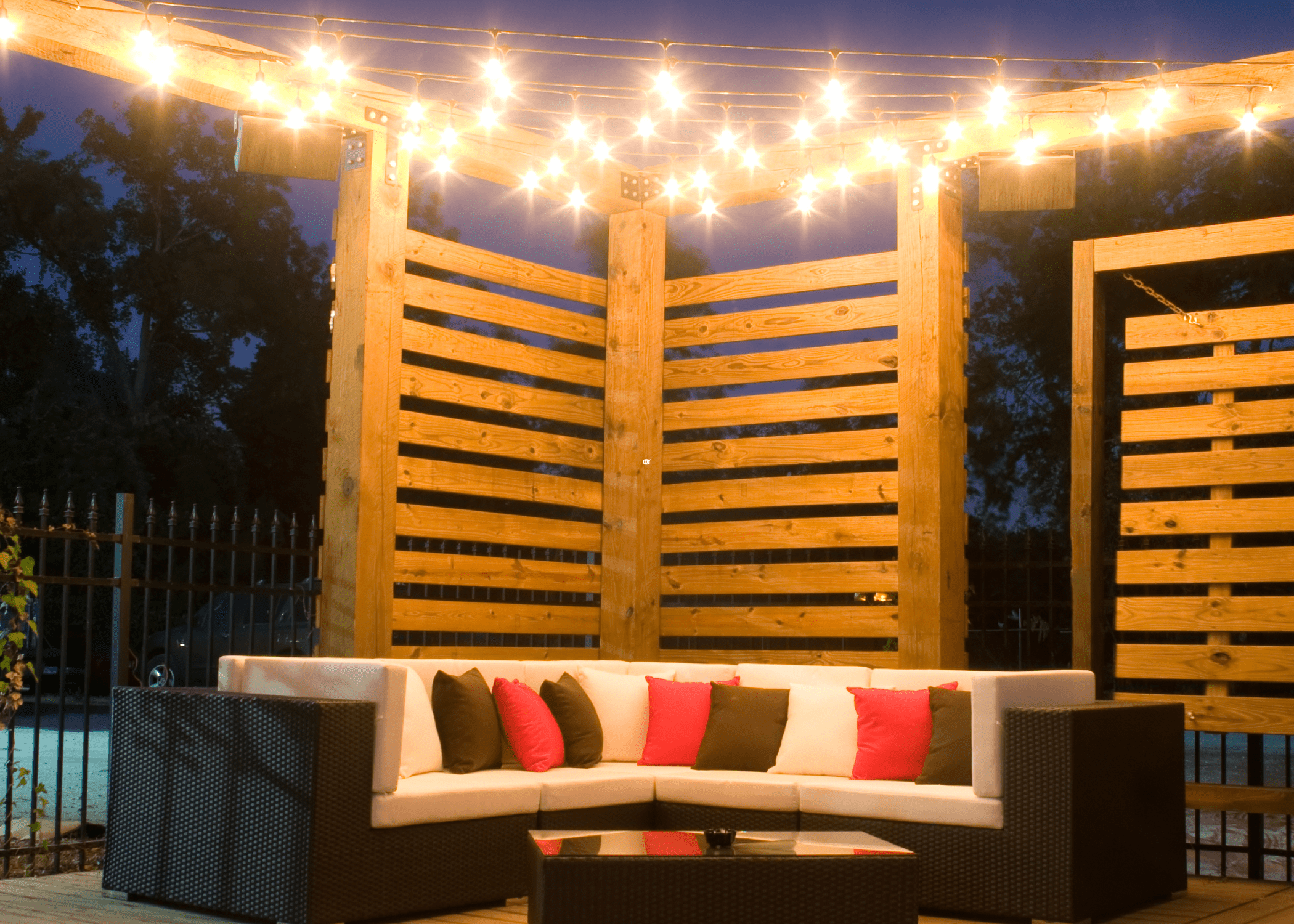 deck at night time with light up string lights