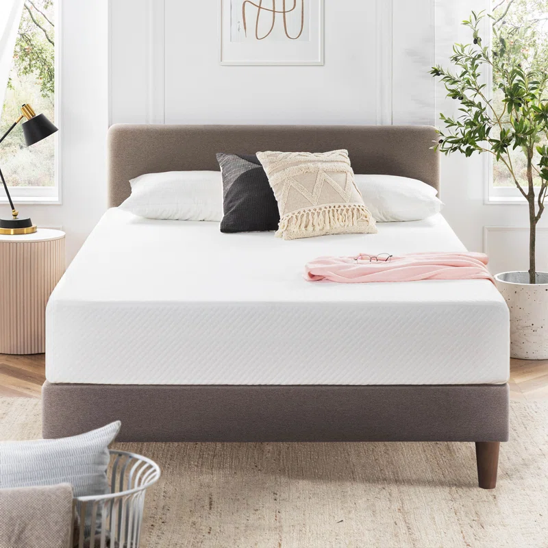 mattress product photo on grey upholstered bed frame