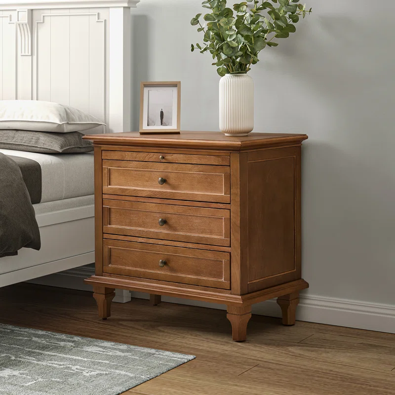 brown wood nightstand next to white wood bed