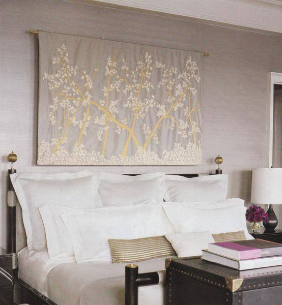 lilac & gray bedroom design with gray walls paint color, black bed, black trunk, black lamp, black nightstands, white bedding, gold pillows and silk gray wall botanical wall panel.