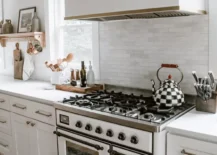 white stove vintage look with large range hood