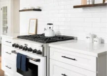 white stove with white countertops and cupboards kitchen