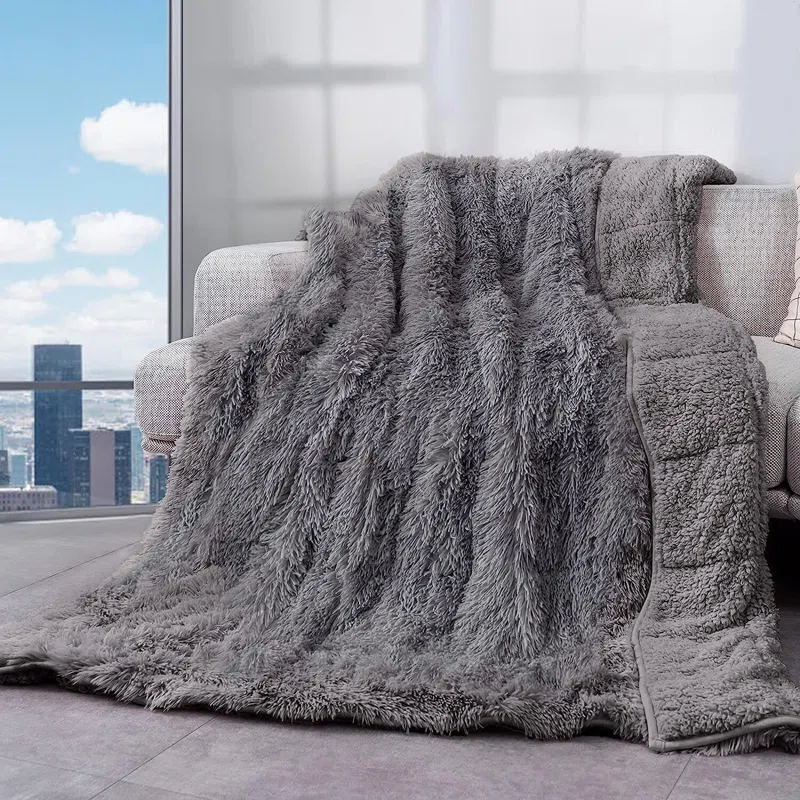 faux fur grey weighted blanket on couch